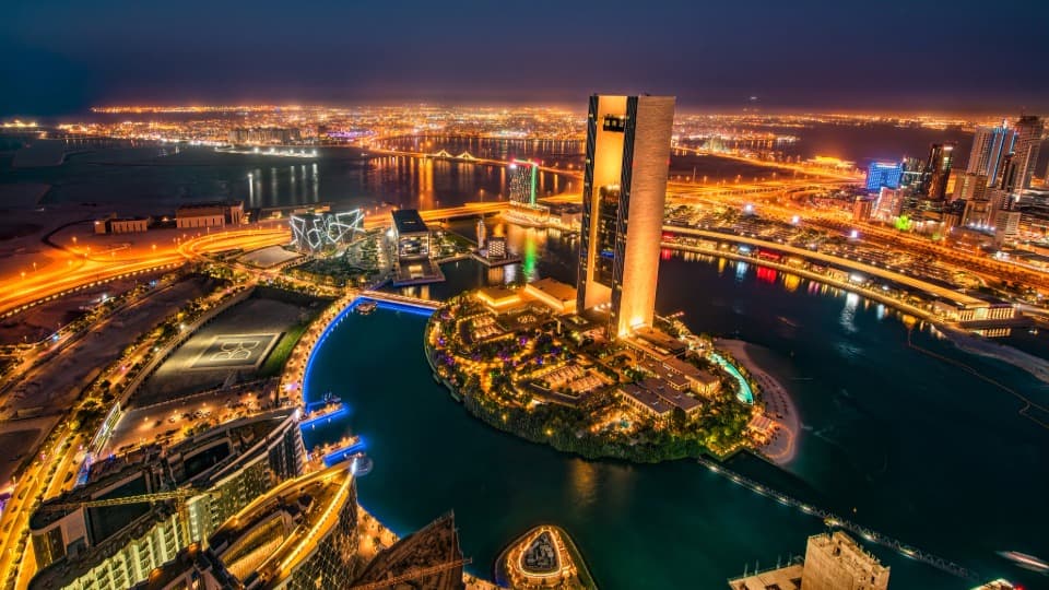 The port in Manama at night, symbolizing everyday life in Bahrain