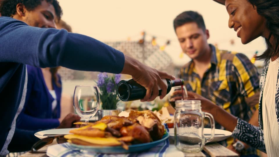 People sharing an outdoor meal as a symbol of everyday life in France