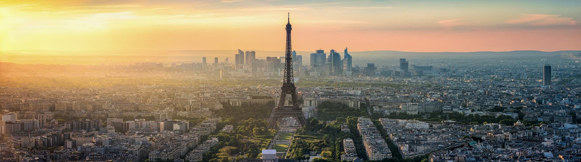Eiffel Tower and Paris city skyline at sunset
