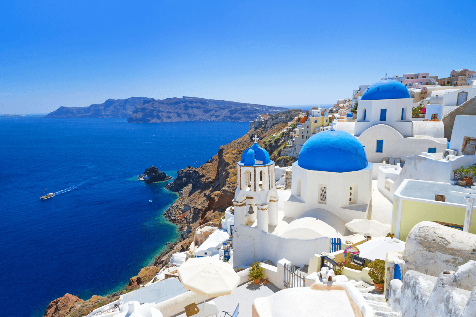 White houses and blue domes on Santorini overlooking the Aegean Sea