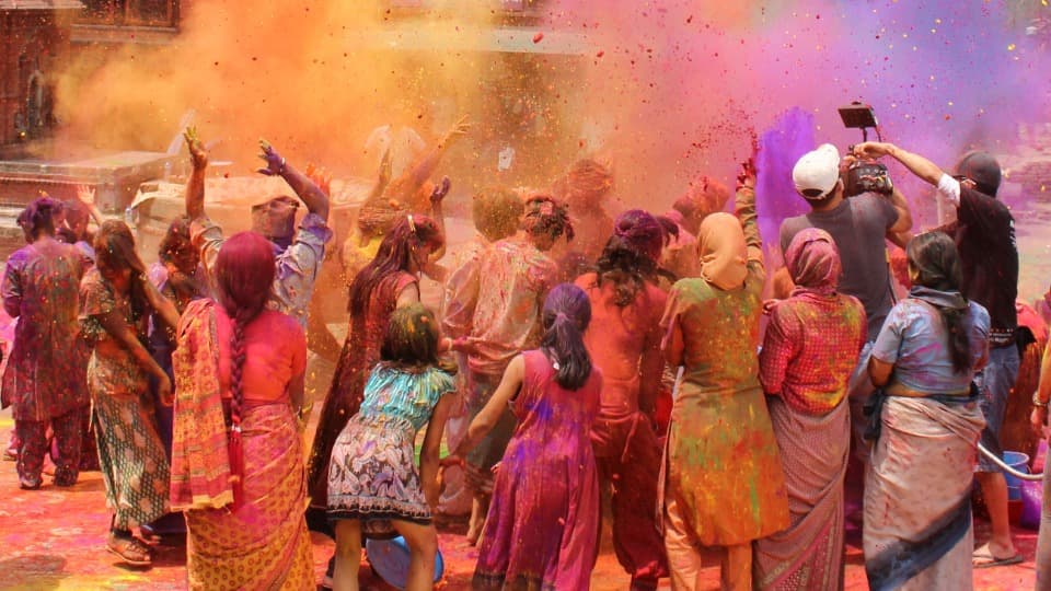 During the Holi festival in India, many people throw colorful powder at each other