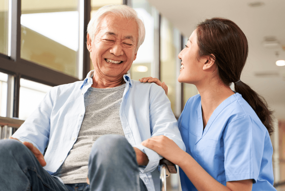 A medical assistant is caring for an elderly Chinese patient