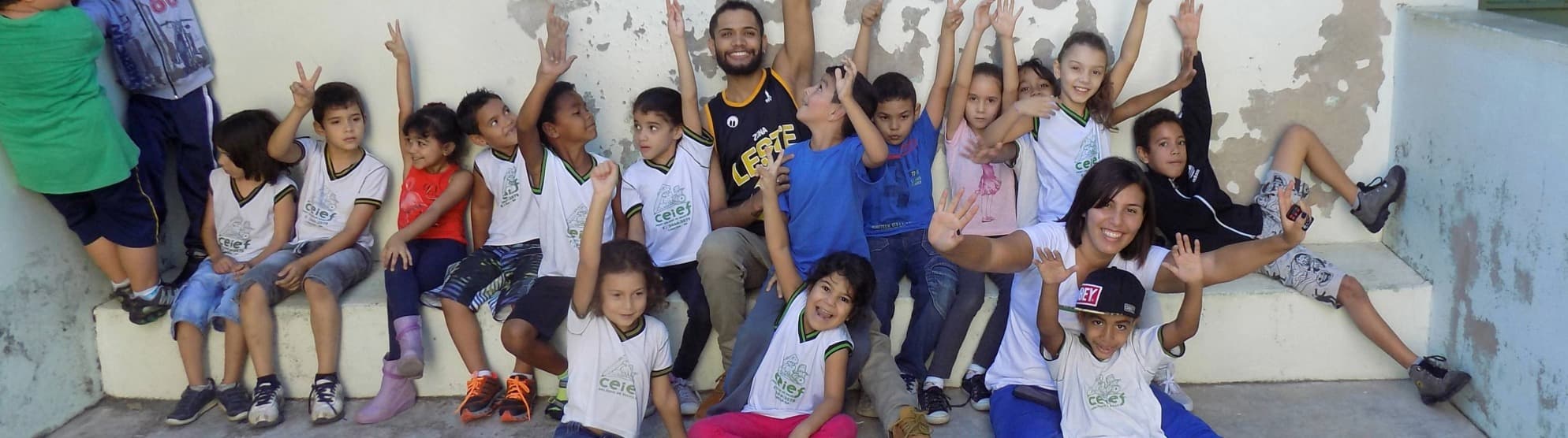 Children at a Terre des Hommes initiative for education and child rights, accompanied by a supporter.