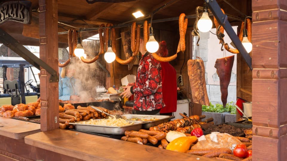 A food stand in Poland serving various meat dishes