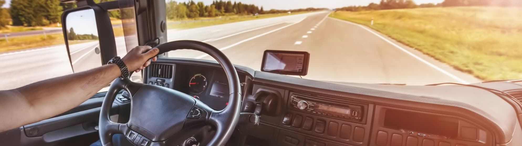 Truck driver at the wheel on a highway – compliance with driving and rest times