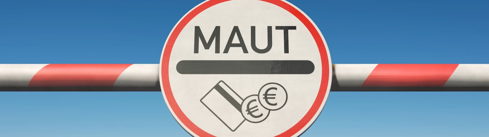 MAUT” sign on barrier with payment symbols – indicating toll fees