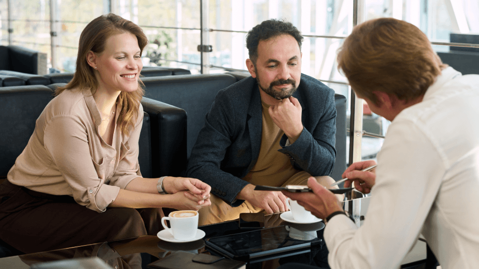A couple receives professional advice on the details of their employee assignment and relocation process.