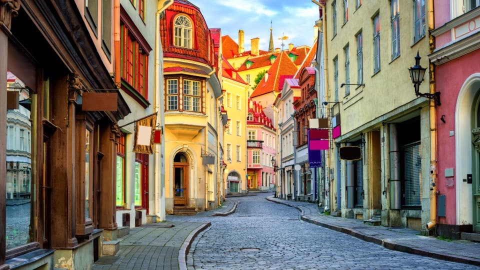 Colourful old town street in Tallinn with historic buildings and cobblestones