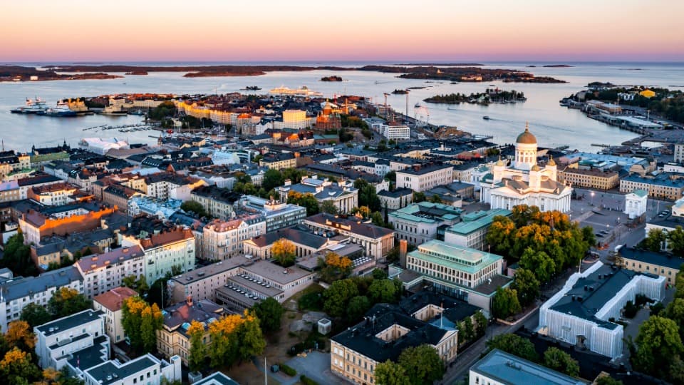 Aerial view of Helsinki with city centre, harbour, islands and cathedral at sunset
