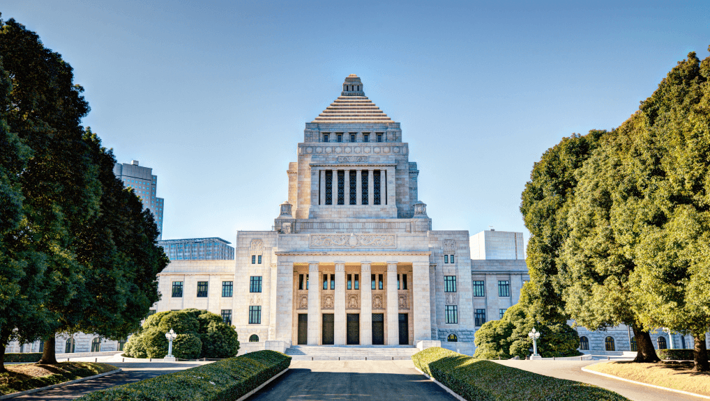 Japanese parliament building in Tokyo, symmetrically framed by trees