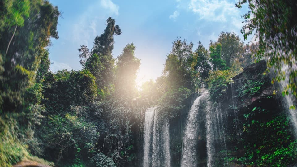 A landscape of tropical forests and waterfalls in Cambodia