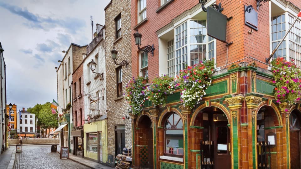 The Quays Bar in Dublin's Temple Bar district as a hub of Irish pub culture and community.