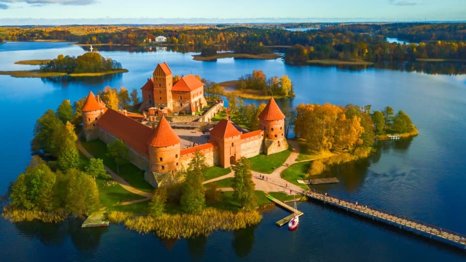 The historic Trakai Water Castle from a bird's-eye view – a symbol of Lithuania's deep-rooted traditions and cultural identity.