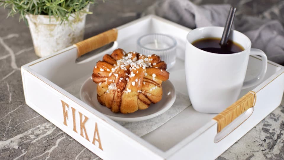 Coffee and Swedish cinnamon buns as symbols of Sweden’s fika culture.