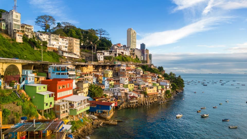 A coastal town in Brazil with colorful houses on the hillside