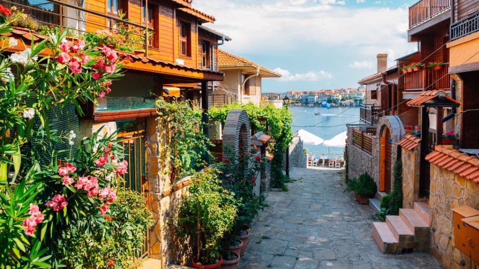 Lane in the Old Town of Sozopol overlooking the Black Sea – essential safety tips regarding underwater currents and daily precautions in coastal towns.