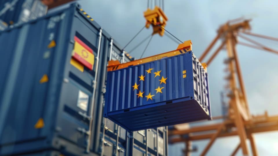 Loading a container with an EU flag by crane, symbolizing secure T2LF transport of moving goods as Union goods.
