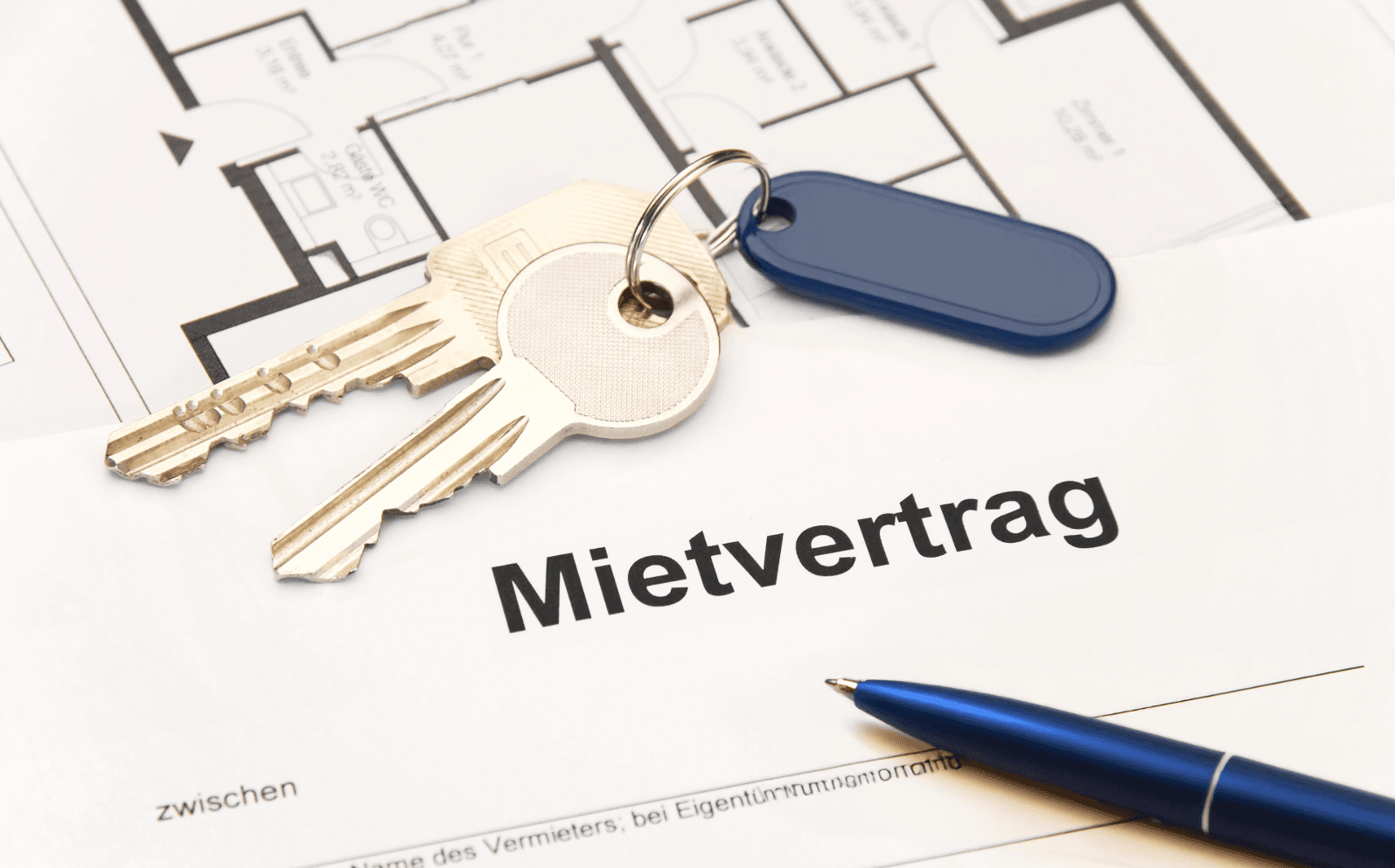 Apartment keys and rental contract on table – essential documents for first apartment tips