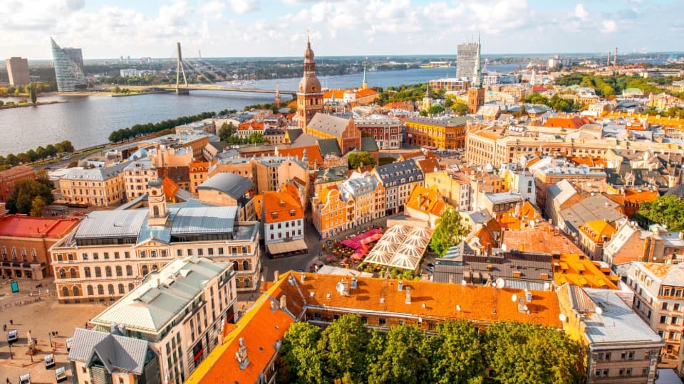 A panoramic view of Riga’s Old Town stretching to the modern skyline – a symbol of Latvia’s economic dynamism and growth.